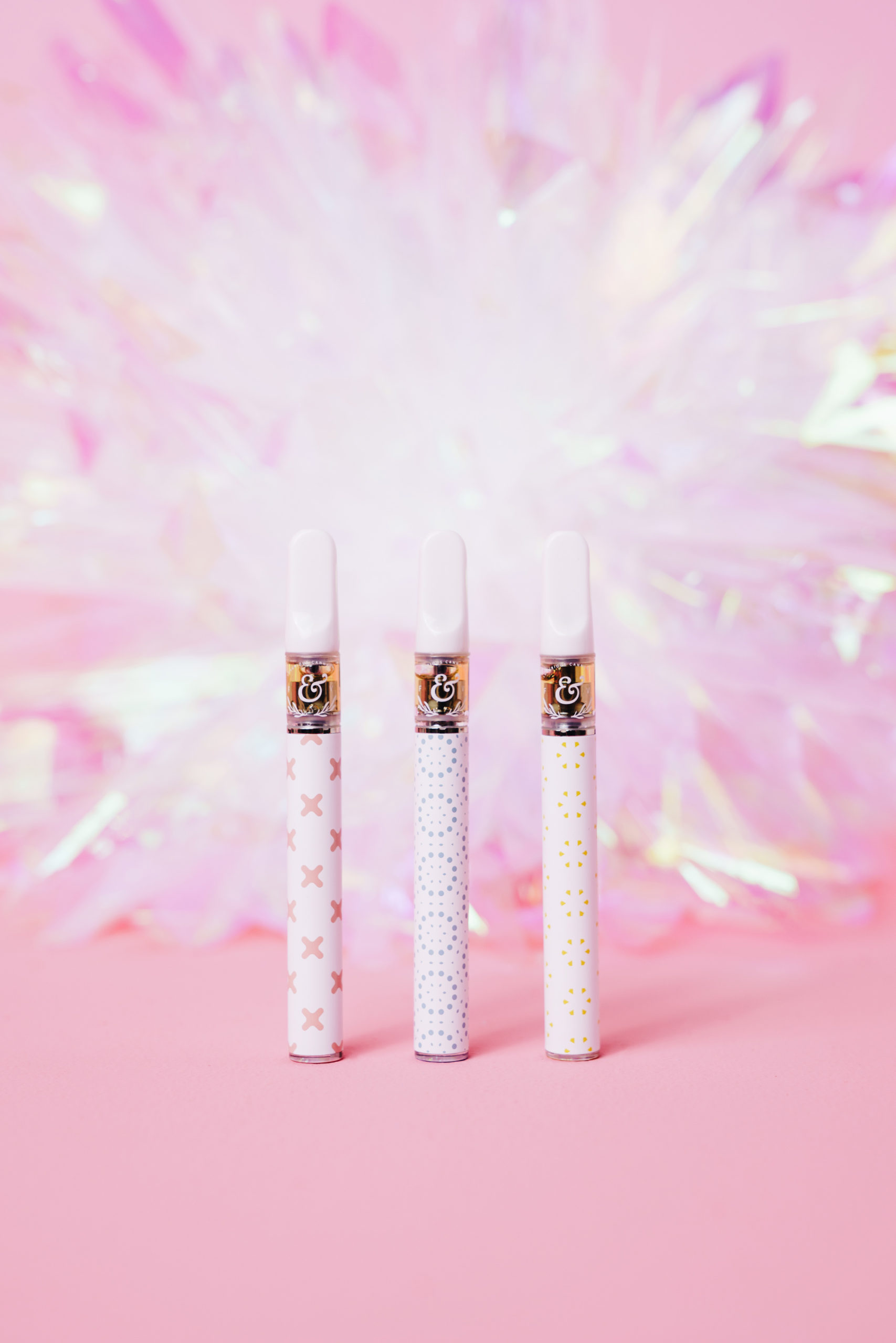 Three Leaf & Vine disposable pens on a blush iridescent field